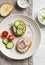 Healthy snack - sandwiches with cream cheese, cucumber and radishes