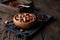 Healthy snack, superfood unroasted cocoa beans in a wooden bowl