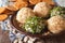 Healthy snacks: Cheese balls with crackers, herbs and seeds close-up. horizontal