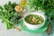 Healthy soup puree of broccoli, celery and herbs with croutons.