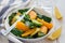 Healthy spinach, avocado and orange salad with ginger-vinegar dressing