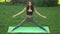 Healthy sports lifestyle. Woman practicing yoga outdoors in park