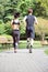 Healthy sports people trail running living an active life. Happy lifestyle couple of athletes training cardio together in summer