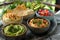 Healthy Spread: Hummus, Guacamole, and Snacks on Patterned Cloth. Concept Healthy Eating, Appetizer