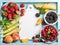 Healthy summer fruit variety. Sweet cherries, strawberries, blackberries, peaches, bananas, melon slices and mint leaves