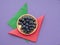 Healthy superfood blueberries on colourful background with paper napkins, serviettes and gold plate.