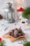 Healthy sweets, homemade candy balls with oatmeal and cocoa, sprinkled with crushed almonds in Christmas style on a star-shaped