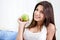 Healthy teenage girl holding a green apple