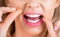 Healthy teeth concept. Teeths Flossing. Oral hygiene and health care. Smiling women use dental floss white healthy teeth