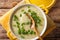 Healthy thick egg soup with green onions close-up in a bowl. Horizontal top view