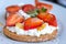 Healthy toast with strawberry, cottage cheese and honey. Tasty breakfast. Summer appetizer