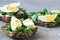 Healthy toasts with arugula and egg. Keto lunch. Open sandwiches with greens and eggs.