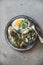 Healthy trendy breakfast plate over grey concrete background