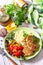 Healthy vegan food, keto or paleo diets. Homemade red fish cutlets with bulgur and fresh vegetable salad on a wooden table.