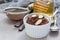 Healthy vegan homemade dessert with avocado, cocoa, vanilla, honey and almond milk, chocolate mousse, copy space