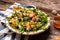 Healthy vegan salad. Arugula, grilled apricots, berries and goat cheese, in a bowl. Diet menu. Healthy salad, Vegan food