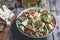 Healthy vegan salad with avocado ,beet leaves ,chickpea, broccoli ,tomato,blue cheese