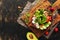 Healthy vegan salad with fresh vegetables-avocado, radish, tomato, cucumber, celery, seeds on a cutting board. View from above,