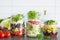 Healthy vegetable cheese salad in mason jars