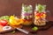 Healthy vegetable chickpea salad in mason jar