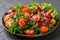 Healthy vegetable salad of fresh tomato, onion , lettuce on plate. Diet menu. Top view