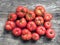 Healthy vegetables. Close up fresh ripe red farm ugly tomatoes on a grey wooden background. Flat lay