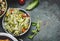 Healthy vegetarian Cabbage salad in bowl on rustic background, top view, close up, border