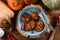 Healthy vegetarian dish flatlay. Pumpkin pancakes on wood slab d