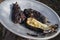 Healthy vegetarian dish with grilled eggplant. Whole eggplants are cooked on an open hearth fire. Ready-made side dish