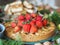 Healthy vegetarian food.Apple cake, muffin or biscuit with strawberries at the top on Thanksgiving festive table. Soft focus or