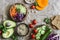 Healthy vegetarian food set background with free space for text. Cabbage, avocado, tomatoes, cucumbers, pumpkin, wild rice on a pa