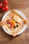 Healthy vegetarian homemade food: crepes or thin pancakes with cheese, egg, tomatoes and mushrooms