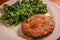 Healthy vegetarian or vegan food, real eggplant and carrot vegetable burger with spinach