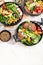Healthy vegetarian and vegan salads and Buddha Bowls with vitamins, antioxidants, protein on light background