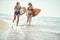 Healthy  watersports at summer vataion.  Girls with  surfboard walking at beach