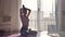 Healthy woman are doing yoga exercises in lotus pose in the morning