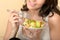 Healthy Woman Eating a Mixed Leaf Salad