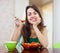 Healthy woman eating veggie salad