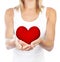 Healthy woman holding heart, selective focus