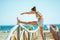 Healthy woman jogger on ocean shore stretching