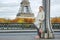 Healthy woman on Pont de Bir-Hakeim bridge looking into distance