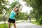 Healthy woman warming up before jogging run and relax stretching her arms