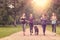 Healthy Women Jogging at the Park with a Dog