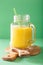 Healthy yellow smoothie with mango pineapple banana in mason jar