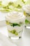 Healthy yogurt dessert with kiwi fruit, jell and cream in glass .