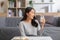 Healthy Young Asian woman Drinking milk with calcium for strong bone at home. Smiling indian woman holding soy milk on glass enjoy