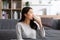 Healthy Young Asian woman Drinking milk with calcium for strong bone at home. Smiling indian woman holding soy milk on glass enjoy