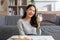 Healthy Young Asian woman Drinking milk with calcium for strong bone at home. Smiling indian woman holding soy milk on glass enjoy