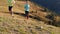 Healthy young couple running on mountain trail in the morning.