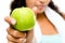 Healthy young mixed race woman holding green apple isolated on w